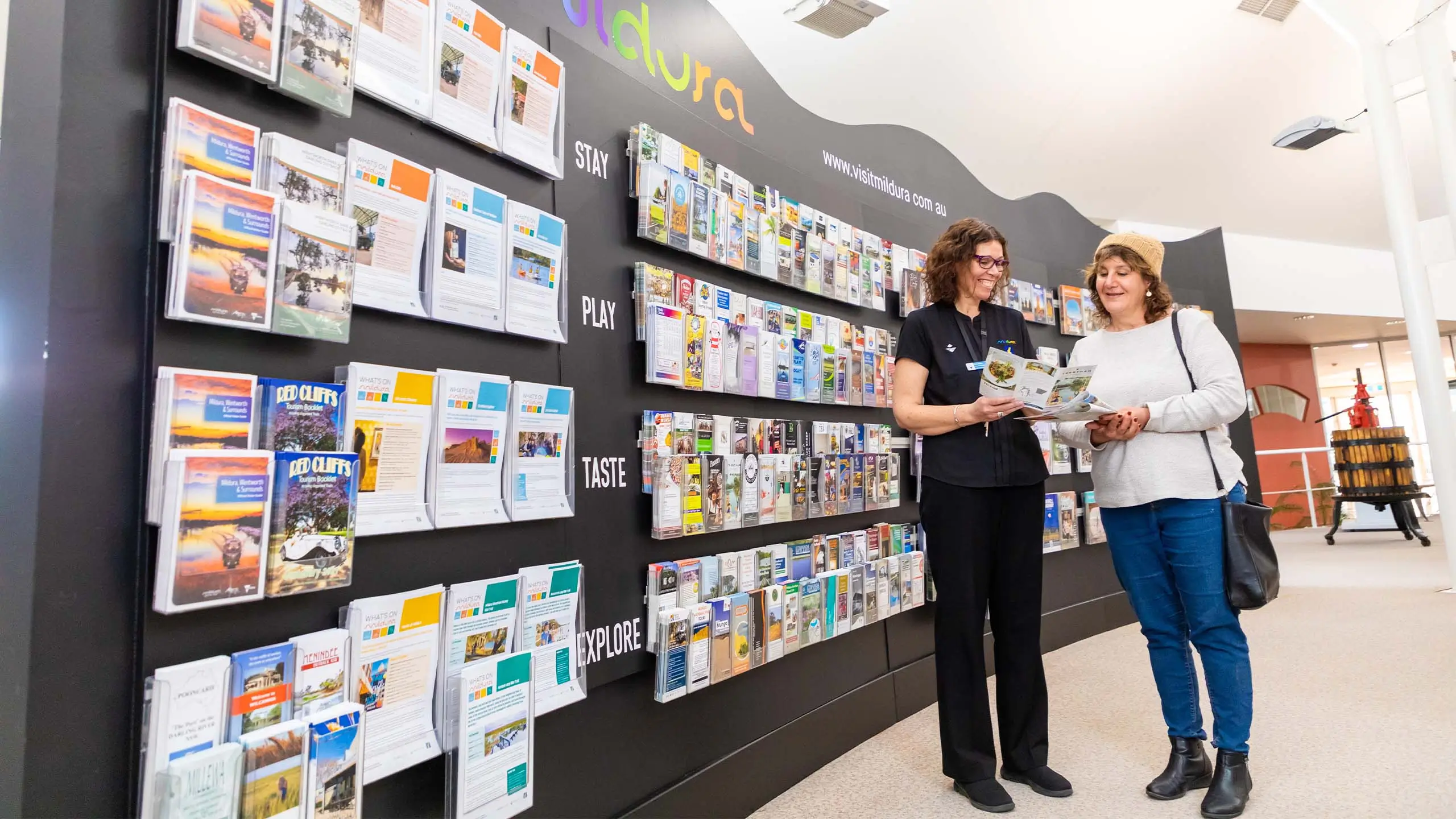 an expert helping a topurist at the Mildura information centre